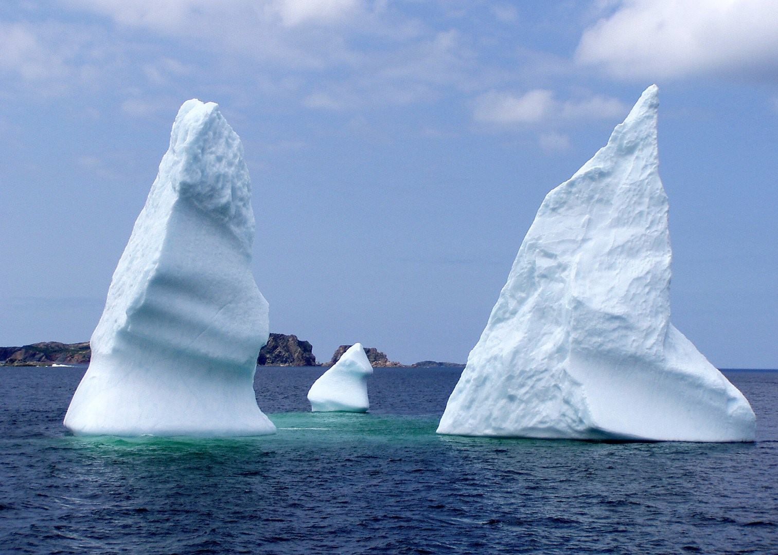 Real icebergs off Twillingate in Newfoundland’s Iceberg Alley Three real icebergs floating off the coast of Twillingate in Newfoundland and Labrador
