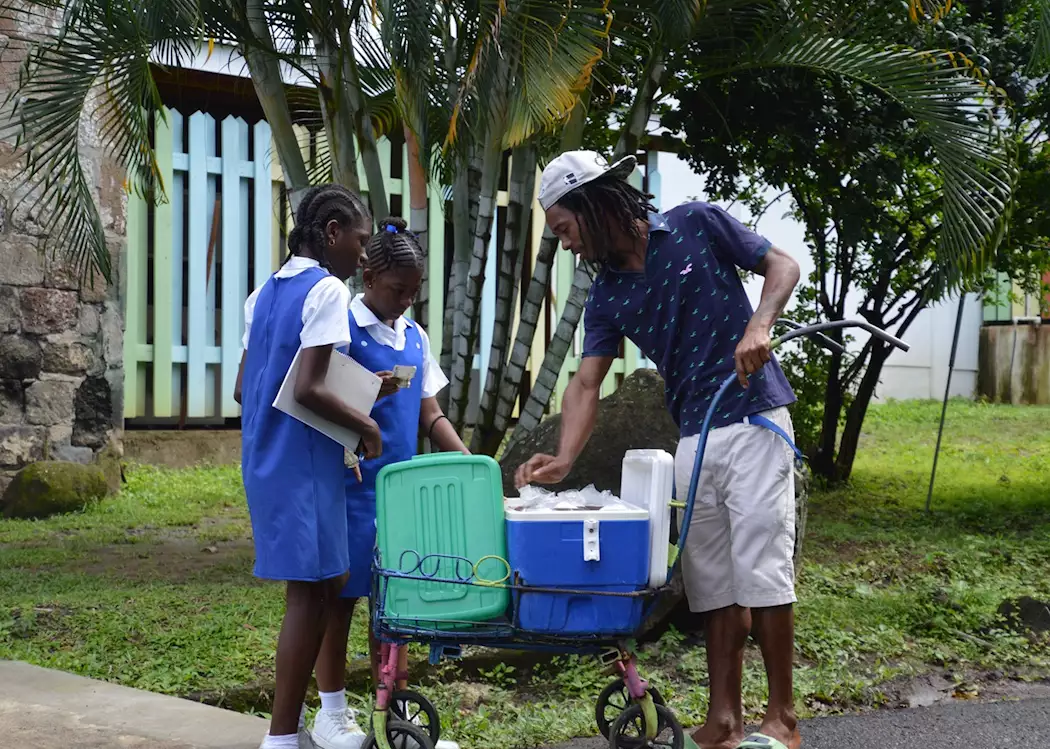 Schoolgirls buying refreshments, Grenada