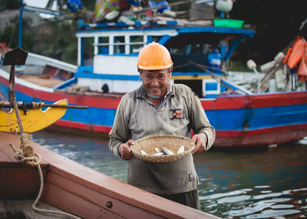 Happy fisherman in Hoi An during the 'Fishermen and Waterways Tour'