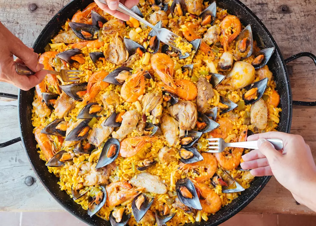 Huge Pans. Cooking Paella Valenciana. Italy Street Food 