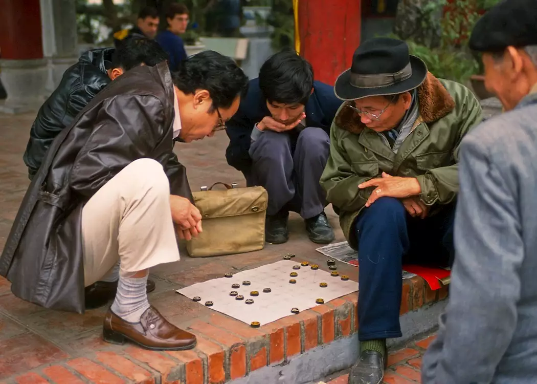 Locals playing a board game, Hanoi