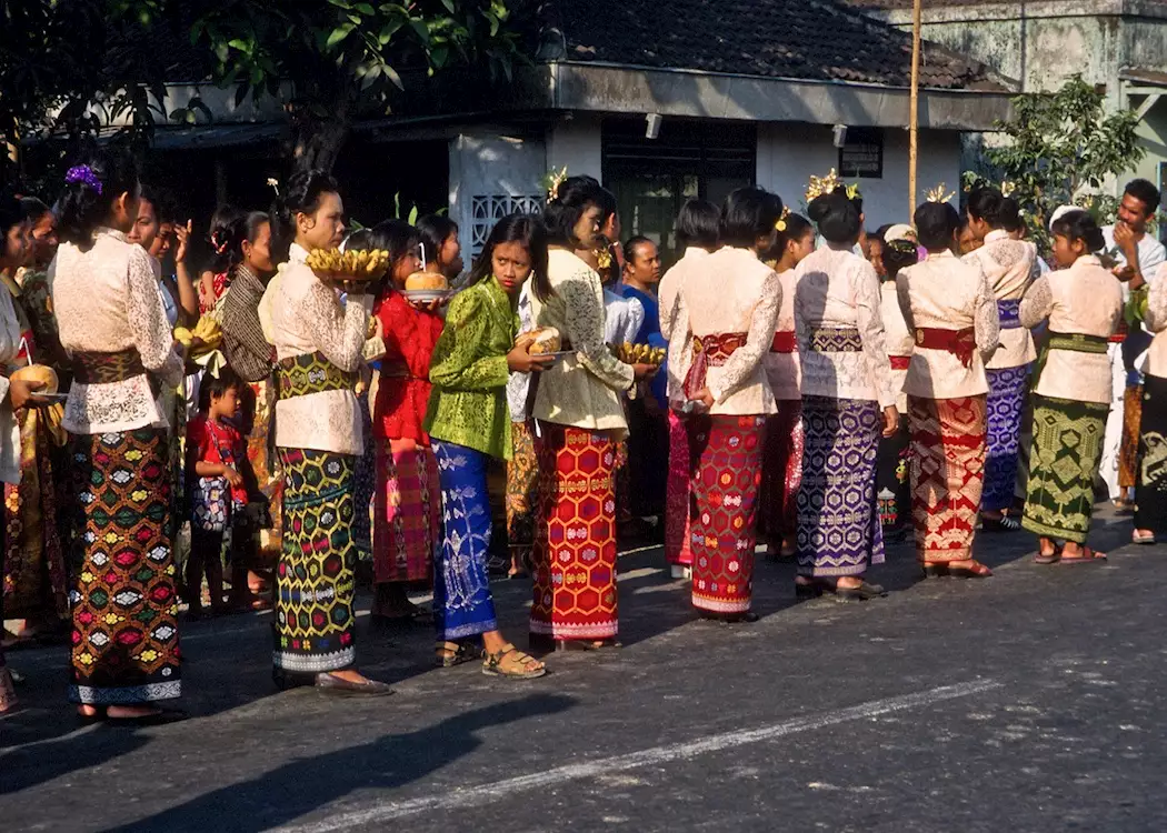 Locals on their way to a temple ceremony, Ubud, Indonesia
