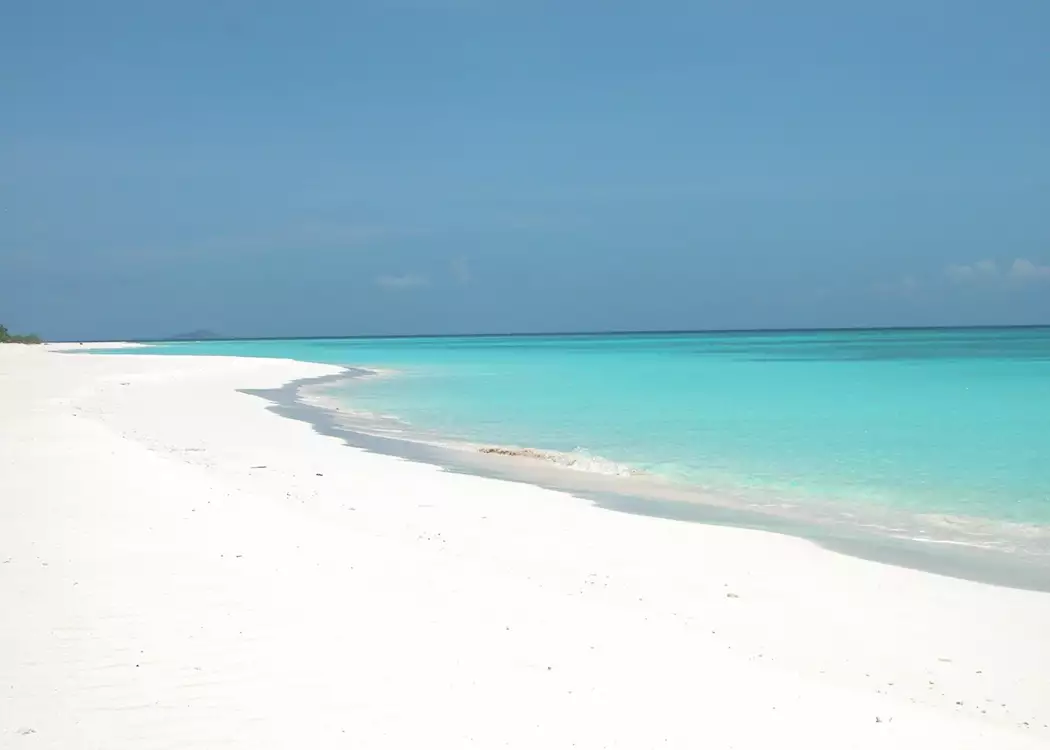 Powder white sand and turquoise sea at the Amanpulo
