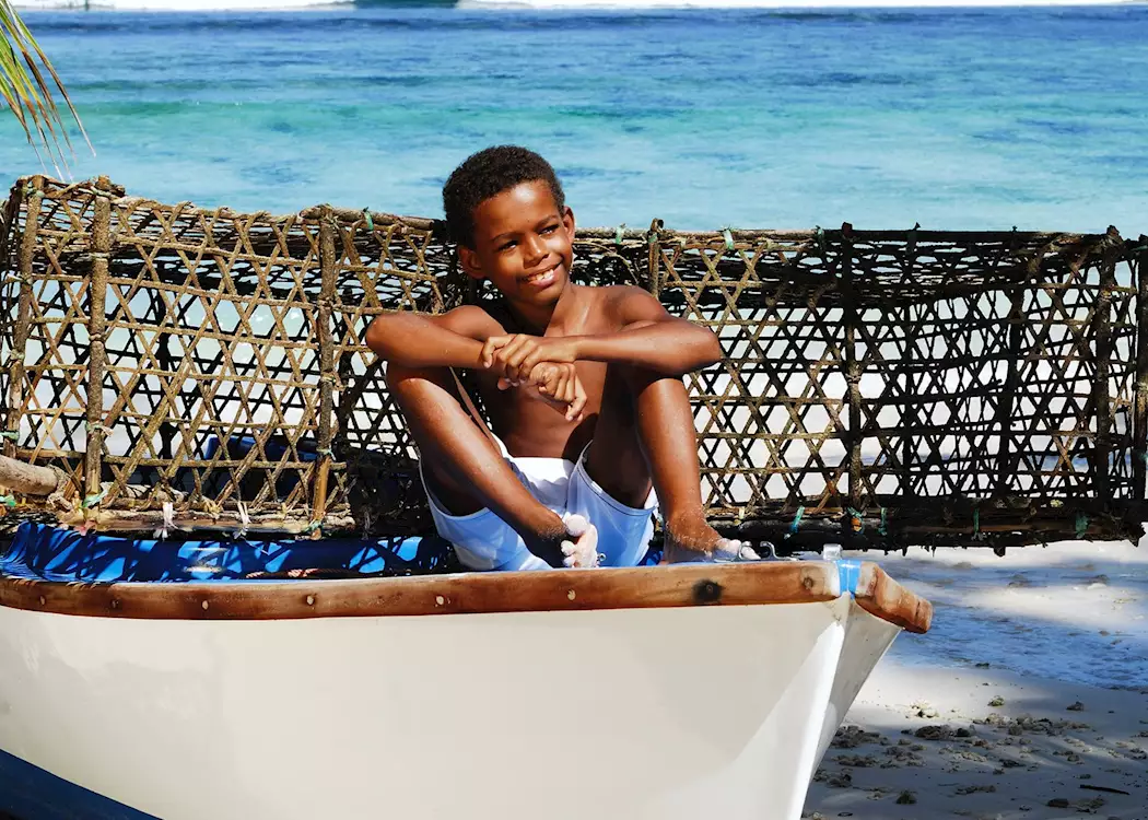 Local boy in a fishing boat