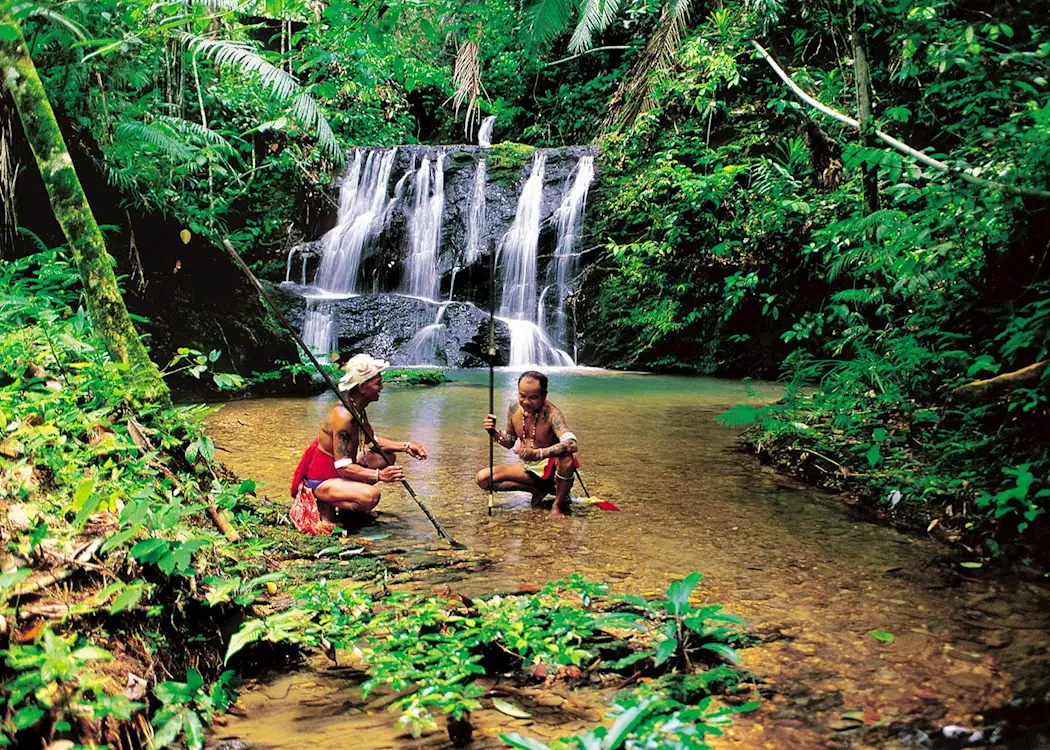 Iban hunters at waterfall, Lemanak River, Malaysian Borneo
