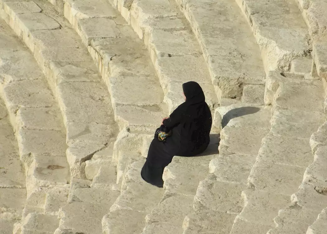 Lady sitting in a Roman theatre, Amman