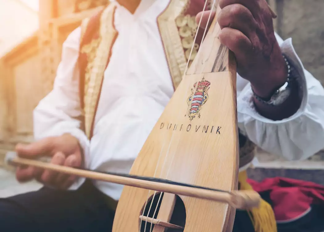 Klapa singer playing mandolin, Dubrovnik