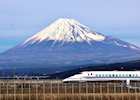 'Shinkansen' bullet train passing by Mount Fuji