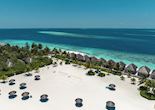 Sun lounging on the beach, Constance Moofushi