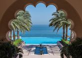Al Husn pool through courtyard arch, Shangri-La Al Husn Resort & Spa, Muscat