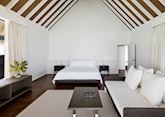 A water villa's master bedroom, COMO Cocoa Island