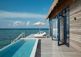 The outdoor pool and deck of a water villa at COMO Cocoa Island