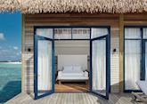 The master bedroom of a water villa, COMO Cocoa Island