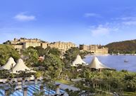 View across the Leela Palace pool & spa to Udaipur