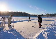 Playing ice hockey near Inn on the Lake, Whitehorse