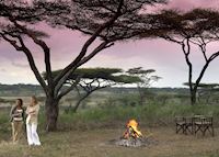 Enjoying sundowner drinks at Kirurumu Serengeti Mobile Camp Enjoying sundowner drinks at Kirurumu Serengeti Mobile Camp