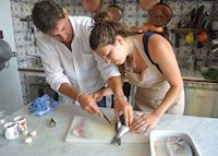 Filleting fish at Casa Laura's cooking class Filleting fish at Casa Laura's cooking class