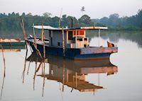 Fishing boat on the Kinabatangan River, Malaysian Borneo Fishing boat on the Kinabatangan River, Malaysian Borneo