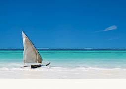 Dhow boat in the crystal blue waters of Zanzibar 
