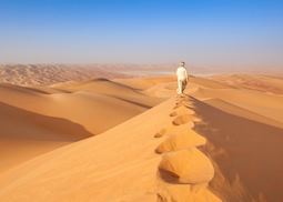 Man walking in Oman's Empty Quarter