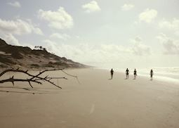 Walking along the beach at sunrise, Tana River Delta