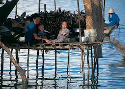 Local family resting in their house on Tonle Sap Lake, Siem Reap
