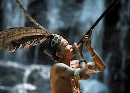Iban tribesman with blow pipe, Batang Ai, Sarawak