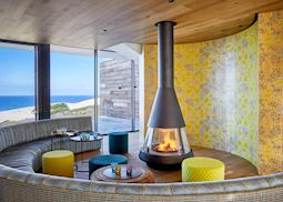Morukuru Beach Lodge, fireplace in restaurant