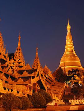 The Shwedagon Pagoda shines bright in the evening