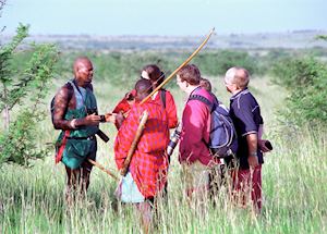 Rekeros Jackson walking with guests, Rekero Tented Camp Rekeros Jackson walking with guests, Rekero Tented Camp