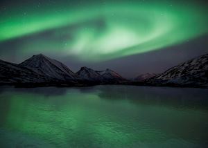 Aurora Borealis over a frozen pond