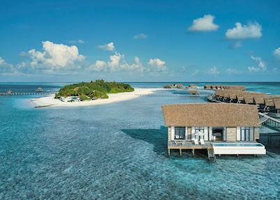 Aerial view of COMO Cocoa Island's water villas