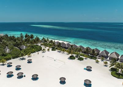 Sun lounging on the beach, Constance Moofushi