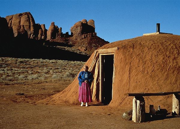 Navajo woman with hogan, Monument Valley Navajo woman with hogan, Monument Valley