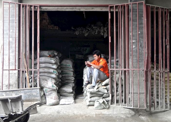 Man sitting in Beijing hutongs
