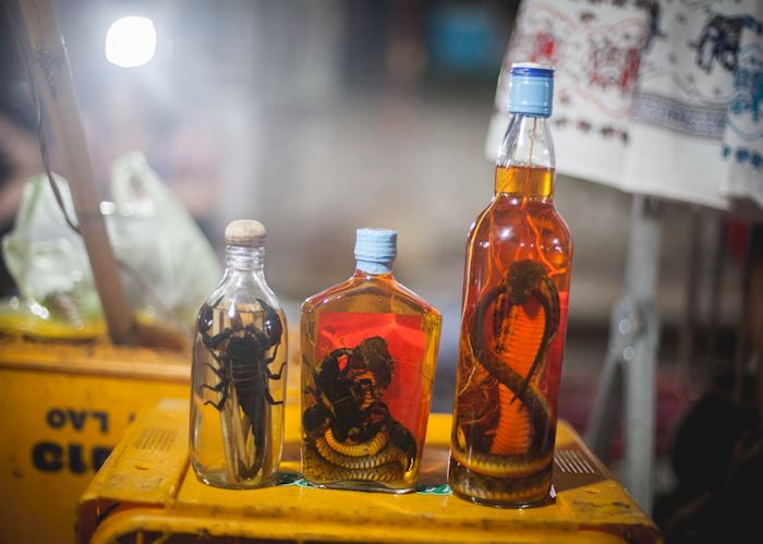 Infused alcohol for sale at the night market in Luang Prabang