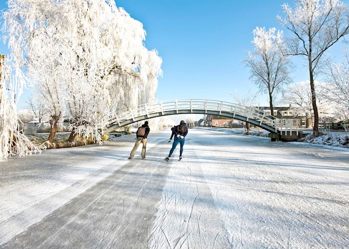 Ice skating on frozen canals, Netherlands