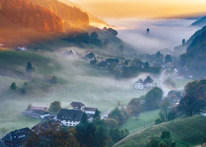 Foggy mountain landscape at sunset