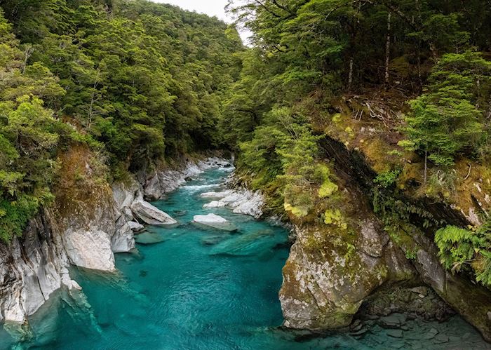 Colorful blue mountain river at the Haast Pass