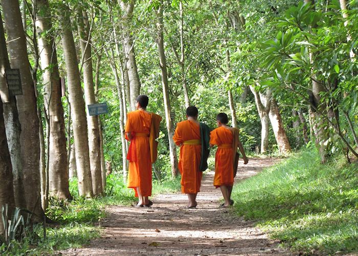 Monks walking by Mount Phousi