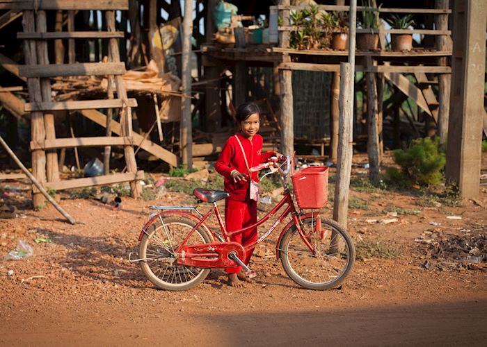 Girl with bicycle near Tonle Sap