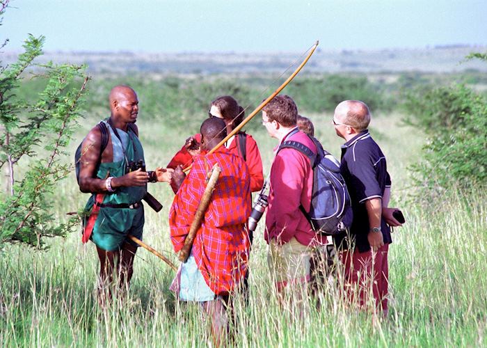 Rekeros Jackson walking with guests, Rekero Tented Camp