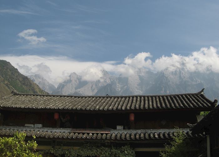 Jade Dragon Mountain over the rooftops on the Tiger Leaping Gorge trek