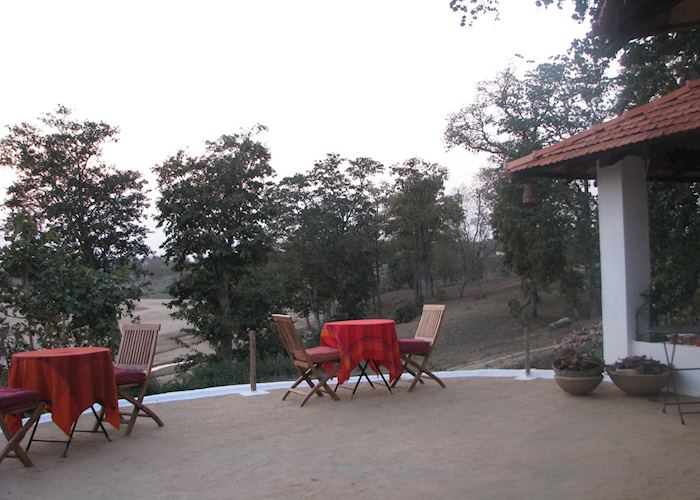 Mud plastered decking offering wonderful views of the Banjaar River from Flame of the Forest, Kanha