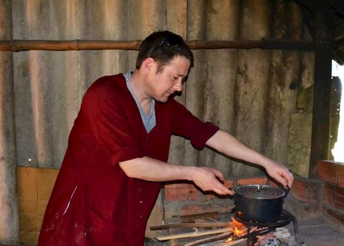 Audley staff member preparing rice pancakes