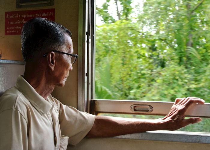 Gentlemen on a local train ride in Amphawa, Thailand