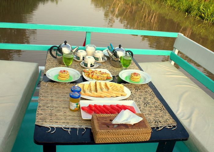 Open Deck breakfast on the Deluxe Klotok Boat