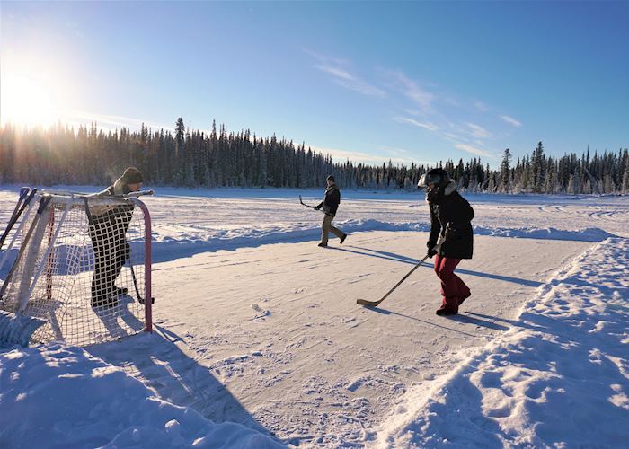 Playing ice hockey near Inn on the Lake, Whitehorse