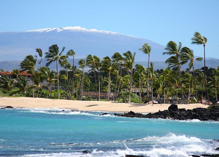 Beach with snow capped Maunakea.