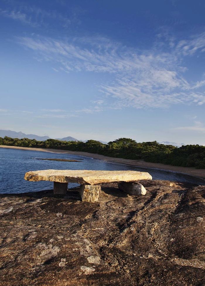 Stone bench overlooking the ocean - Manafiafy, Madagascar